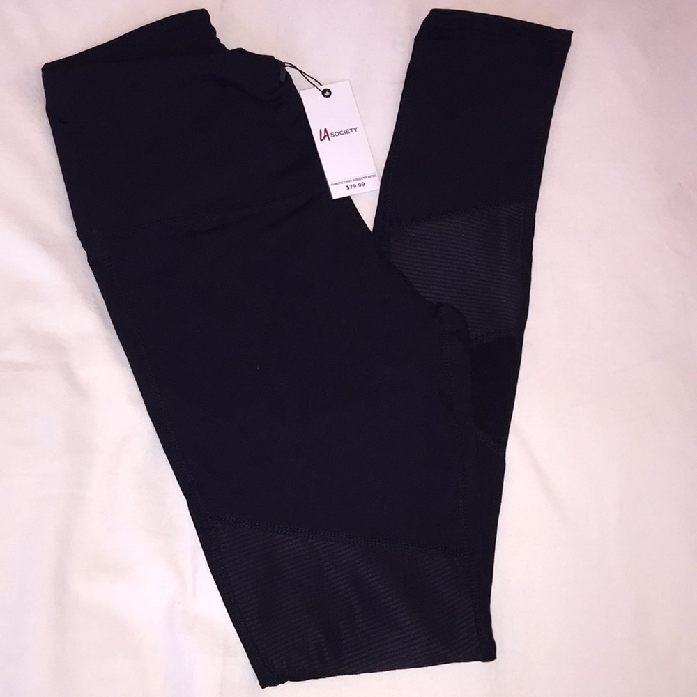 Leggings with mesh cutouts and ruffled accents